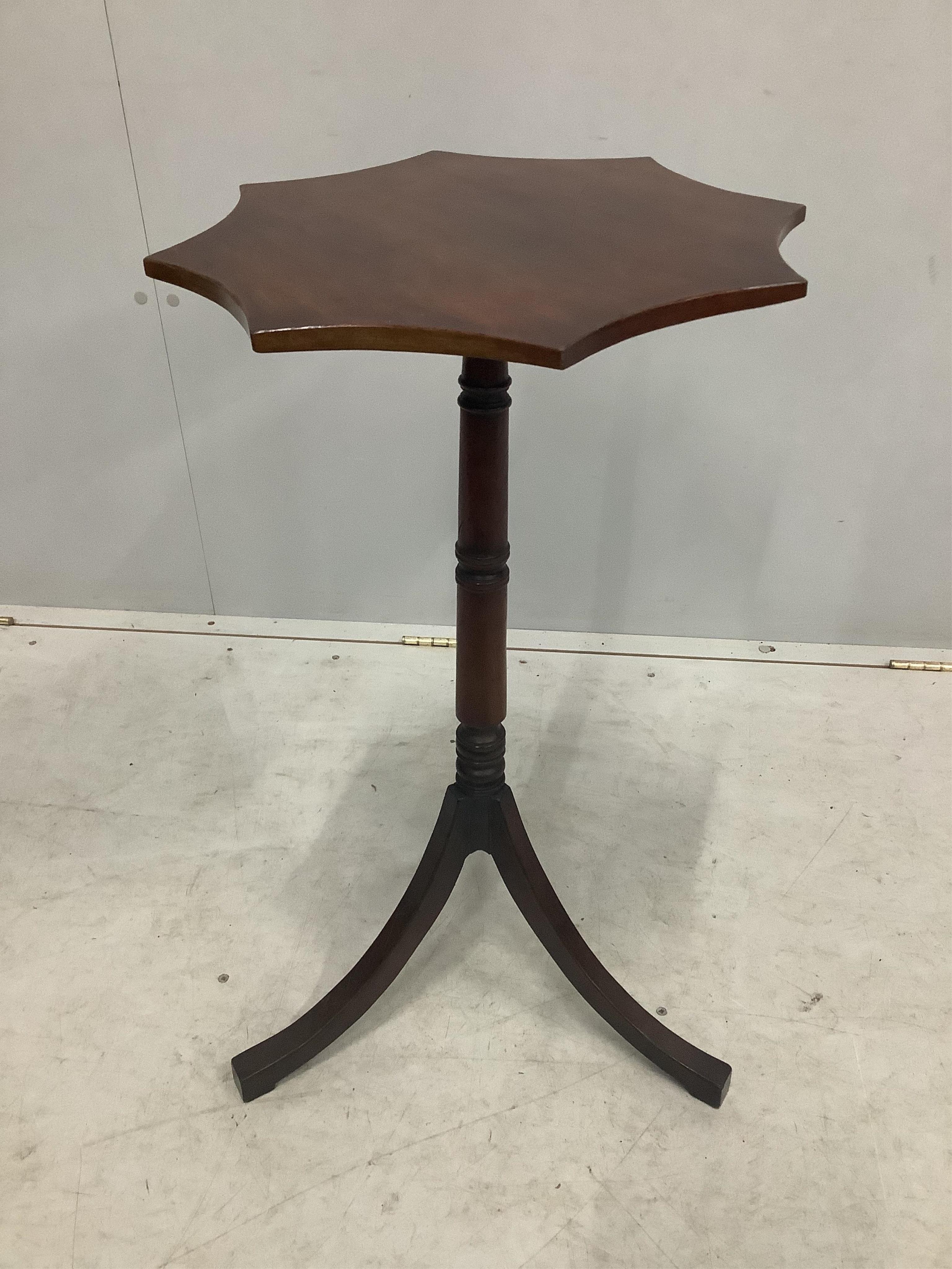 A pair of Regency style mahogany tripod wine tables, width 43cm, height 74cm. Condition - fair to good